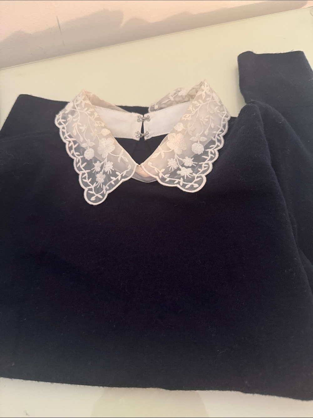Club Monaco embroidered collar navy sweater.